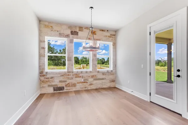 a view of a room with window wooden floor and windows