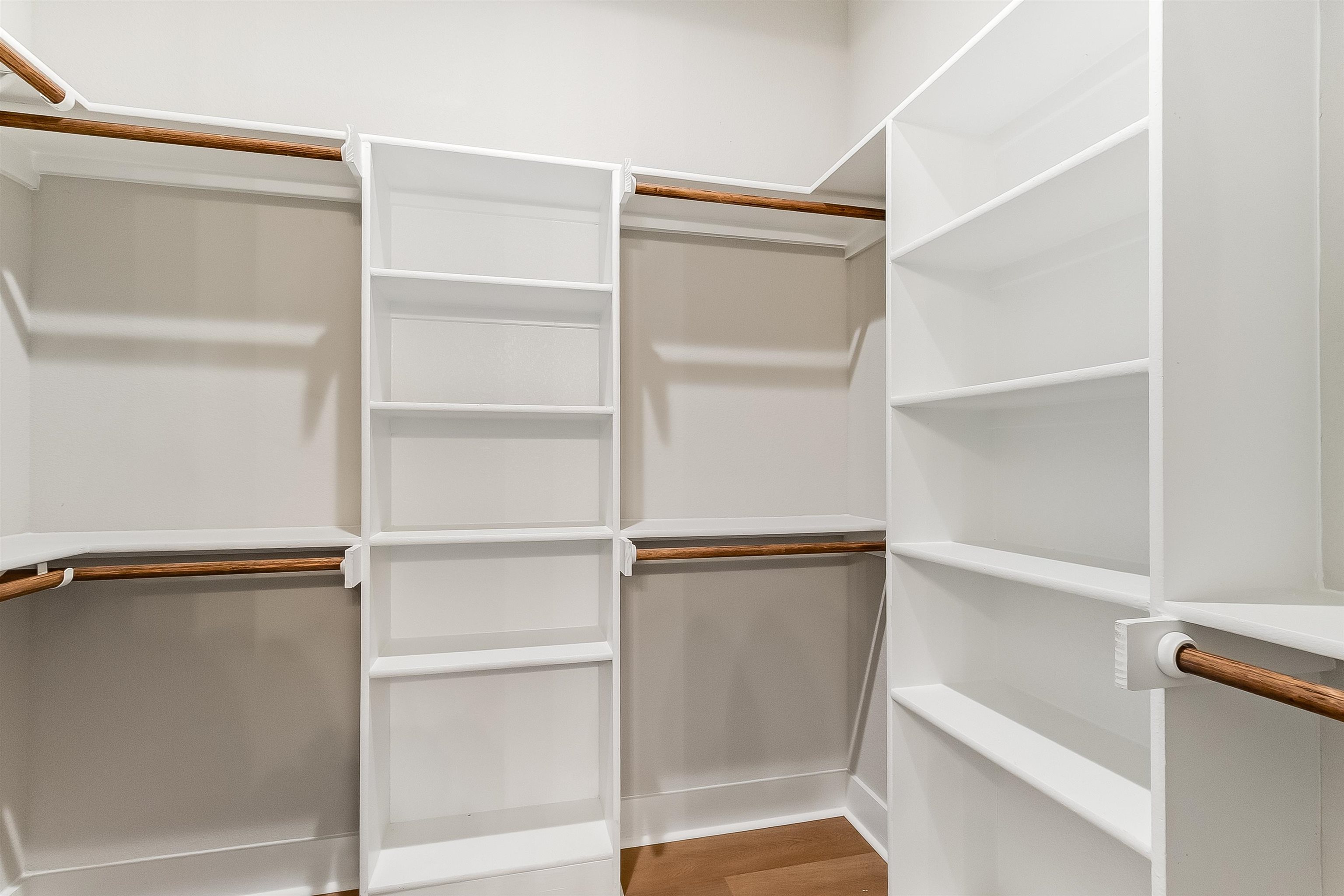 124 Draper Lane Bertram, TX 78605 - Photo 17 of 30 a view of walk in closet with empty racks