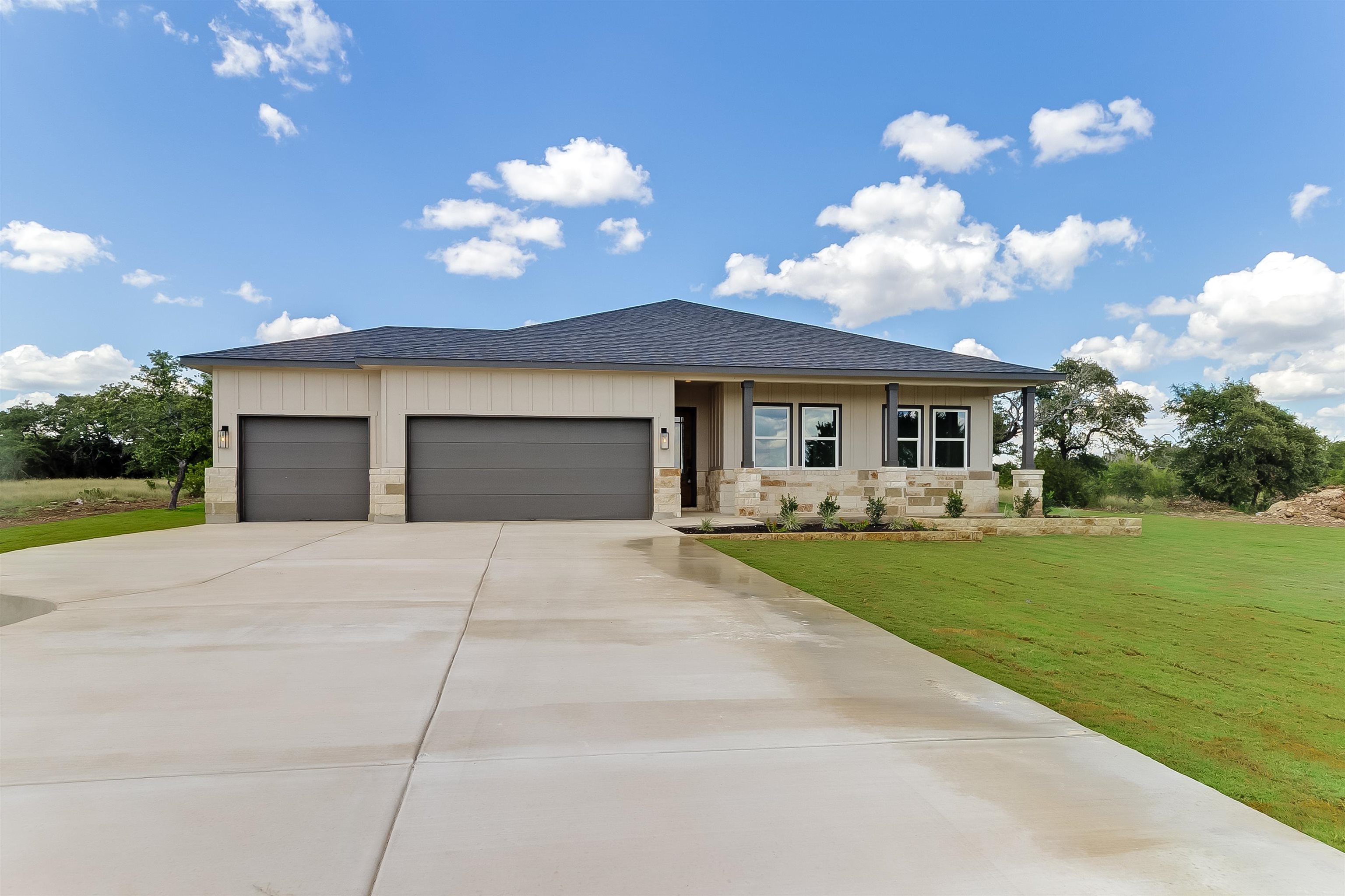 124 Draper Lane Bertram, TX 78605 - Photo 2 of 30 a front view of a house with garden