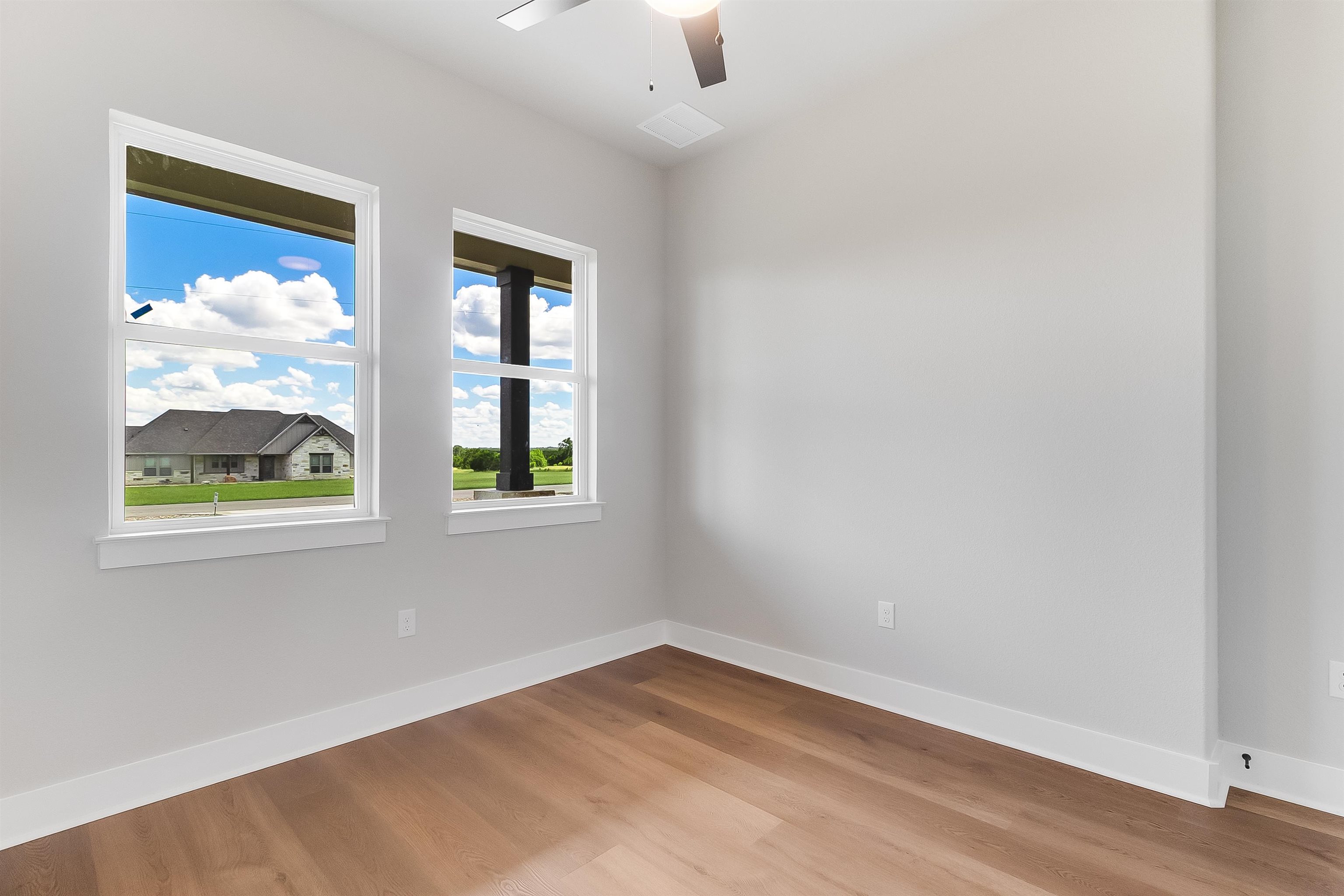 124 Draper Lane Bertram, TX 78605 - Photo 21 of 30 an empty room with windows and closet