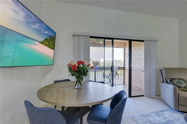 a view of a dining room with furniture window and outside view