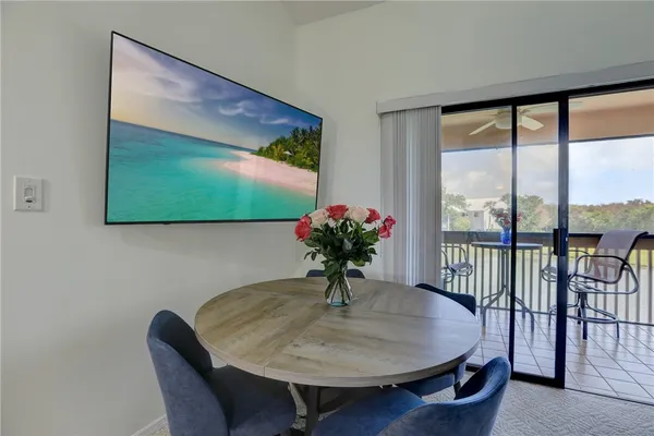 a dining room with furniture and window