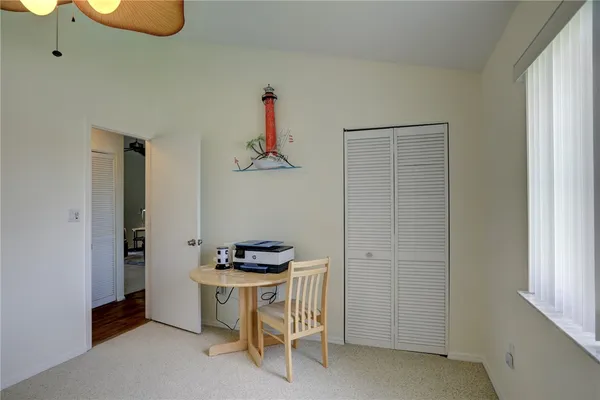 a view of kitchen and white cabinets