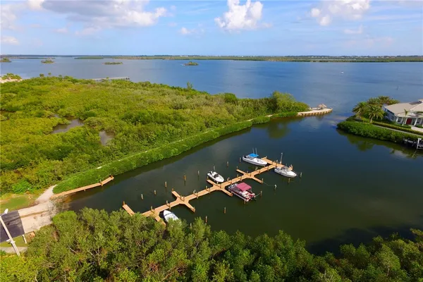 an aerial view of a houses with a lake view
