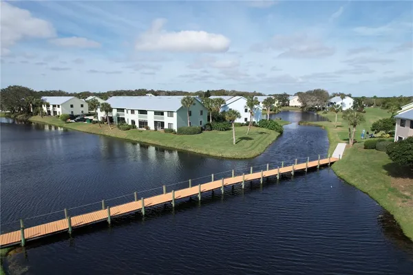 an aerial view of a house with a lake view