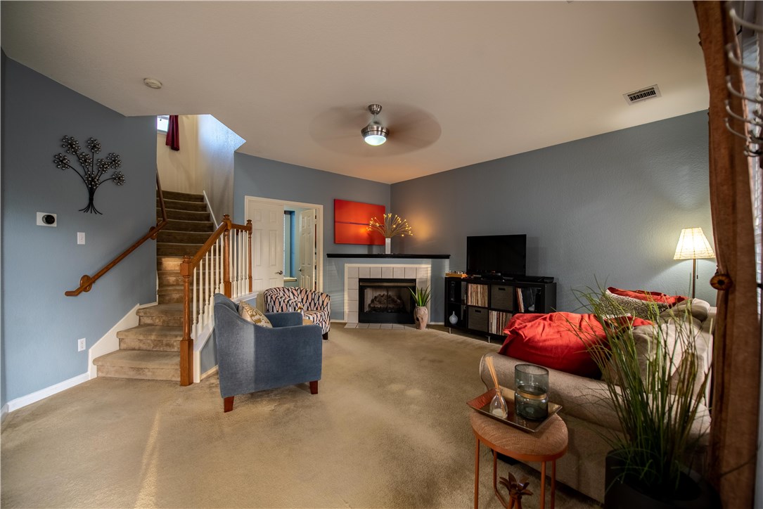 a living room with furniture and a fireplace