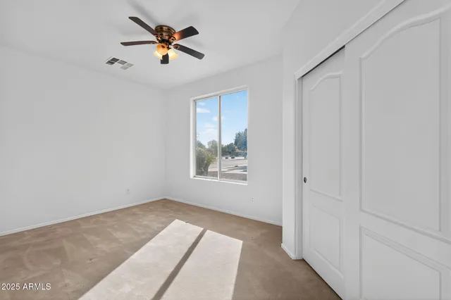 a large kitchen with stainless steel appliances granite countertop a sink and cabinets