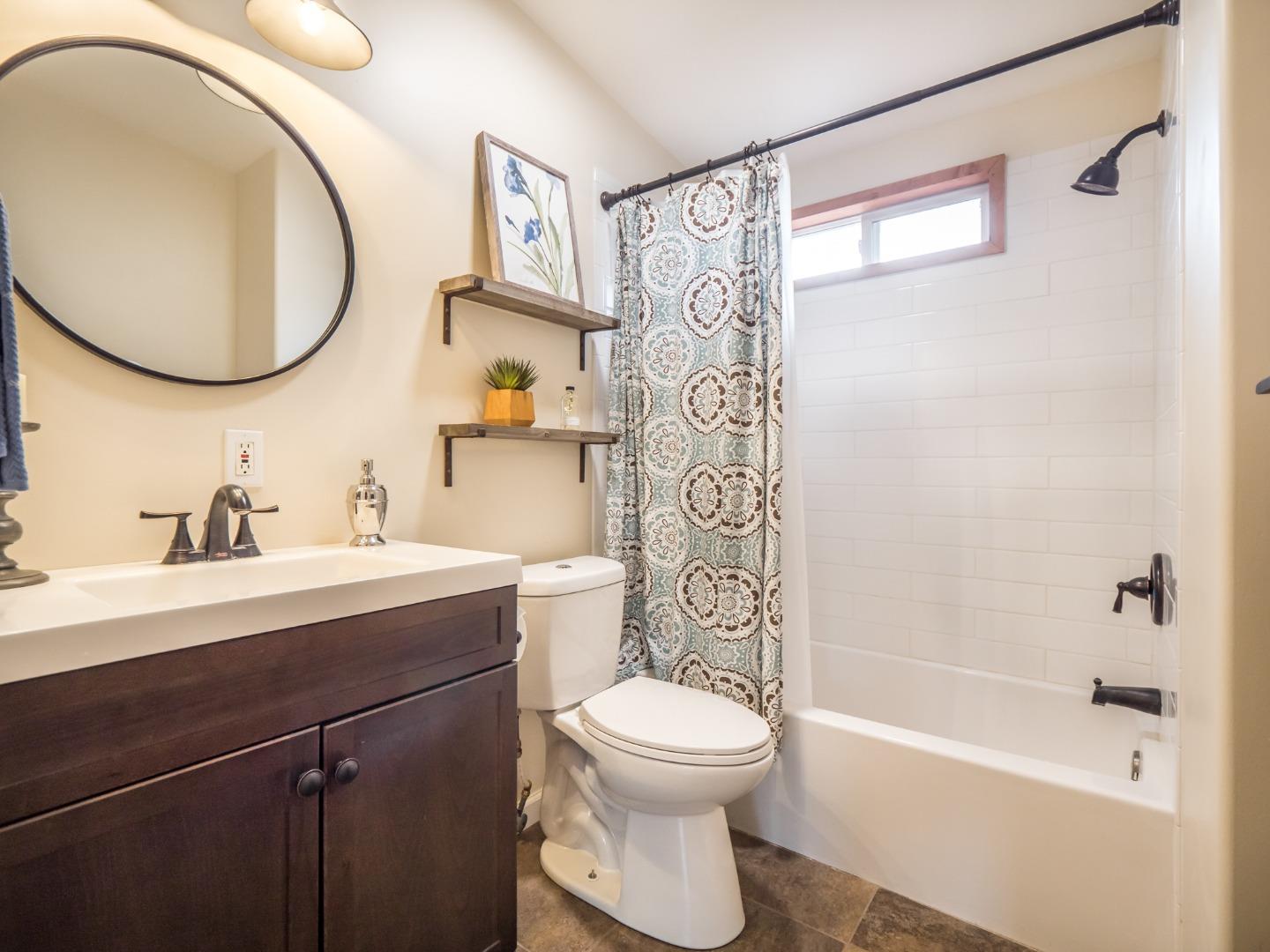 294 Hames Road Watsonville, CA 95076 - Photo 18 of 23 a bathroom with a sink a toilet and a mirror