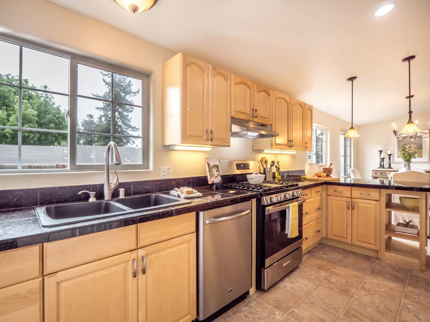 294 Hames Road Watsonville, CA 95076 - Photo 8 of 23 a kitchen with stainless steel appliances a sink stove and cabinets