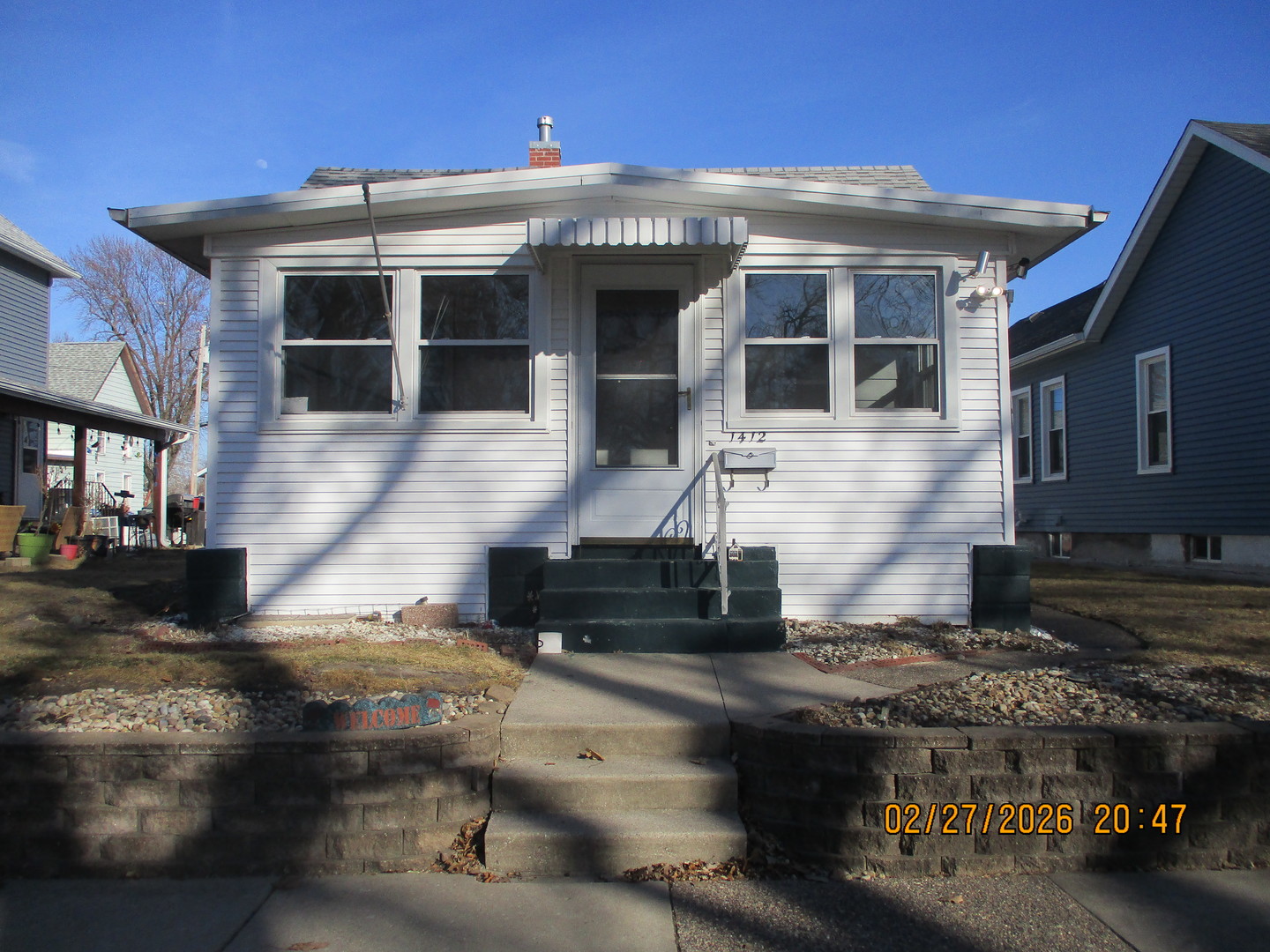 1412 13th Street Moline, IL 61265 - Photo 1 of 31 a front view of a house with a yard