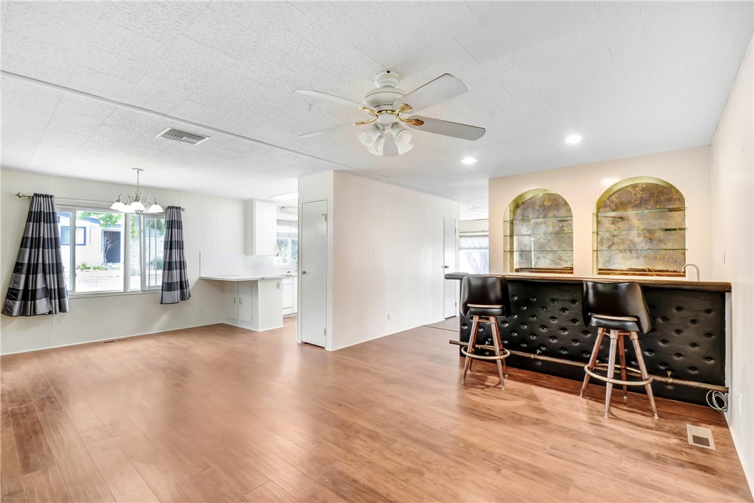 33828 Plowshare Road Wildomar, CA 92595 - Photo 16 of 22 a view of a livingroom with furniture ceiling fan and window