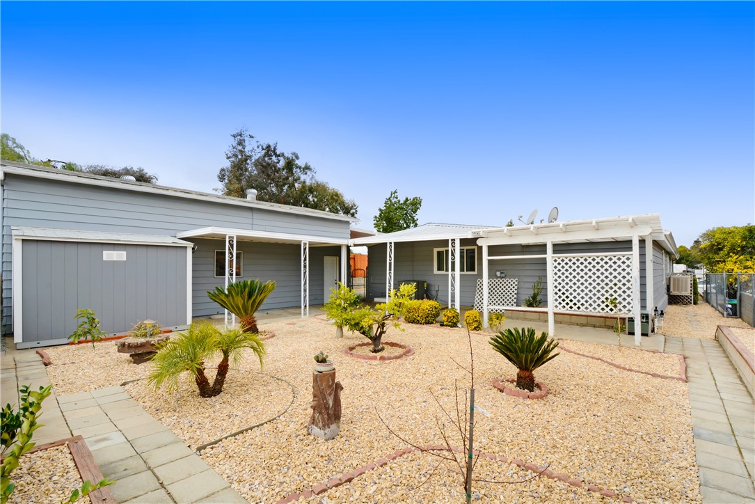 33828 Plowshare Road Wildomar, CA 92595 - Photo 3 of 22 a view of a house with backyard porch and patio