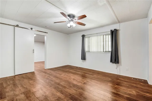 a view of a kitchen with stove and cabinets