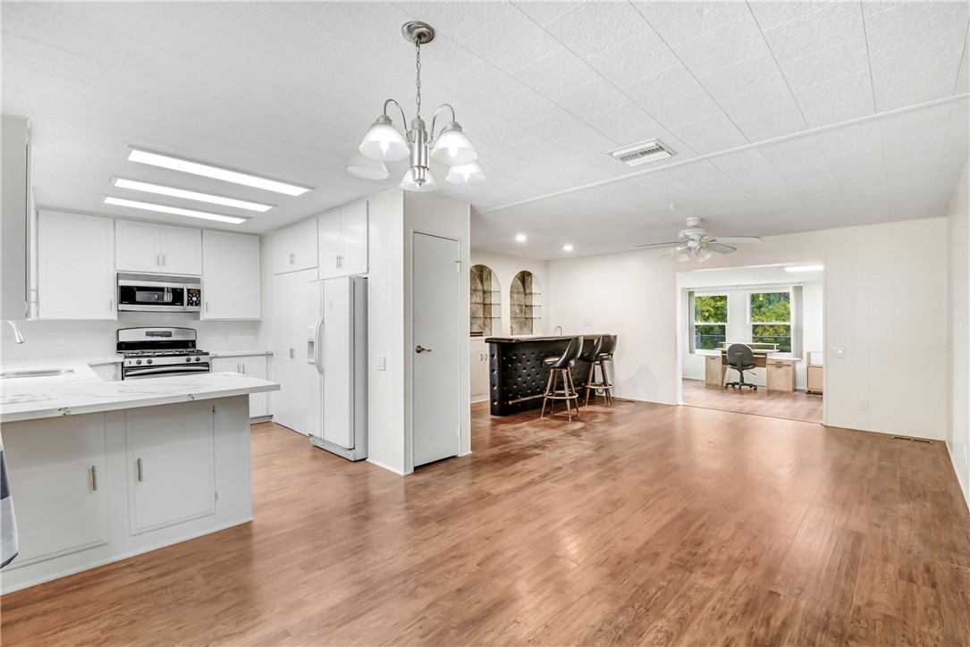 33828 Plowshare Road Wildomar, CA 92595 - Photo 8 of 22 a view of a kitchen with stove and cabinets
