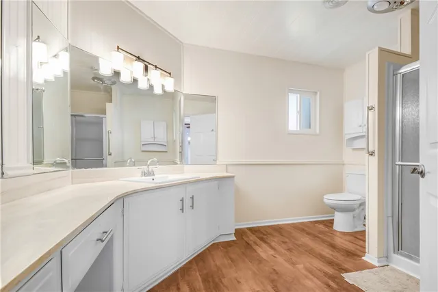 a view of room with window and wooden floor