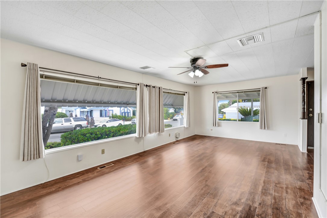 33828 Plowshare Road Wildomar, CA 92595 - Photo 10 of 22 a view of room with window and wooden floor