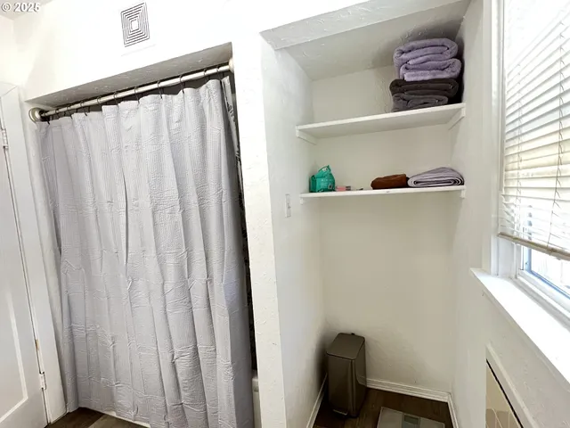 a view of entryway with window and closet