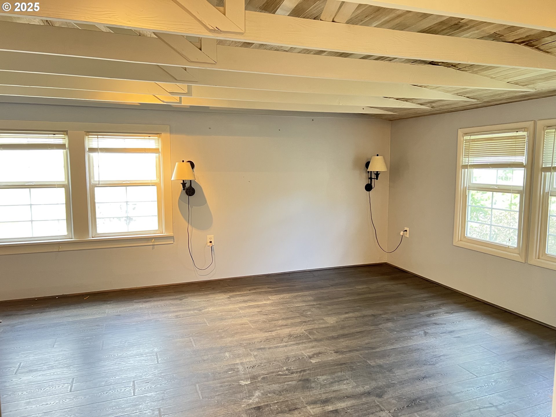 175 Baltimore Street Heppner, OR 97836 - Photo 15 of 28 a view of an empty room with wooden floor and a window