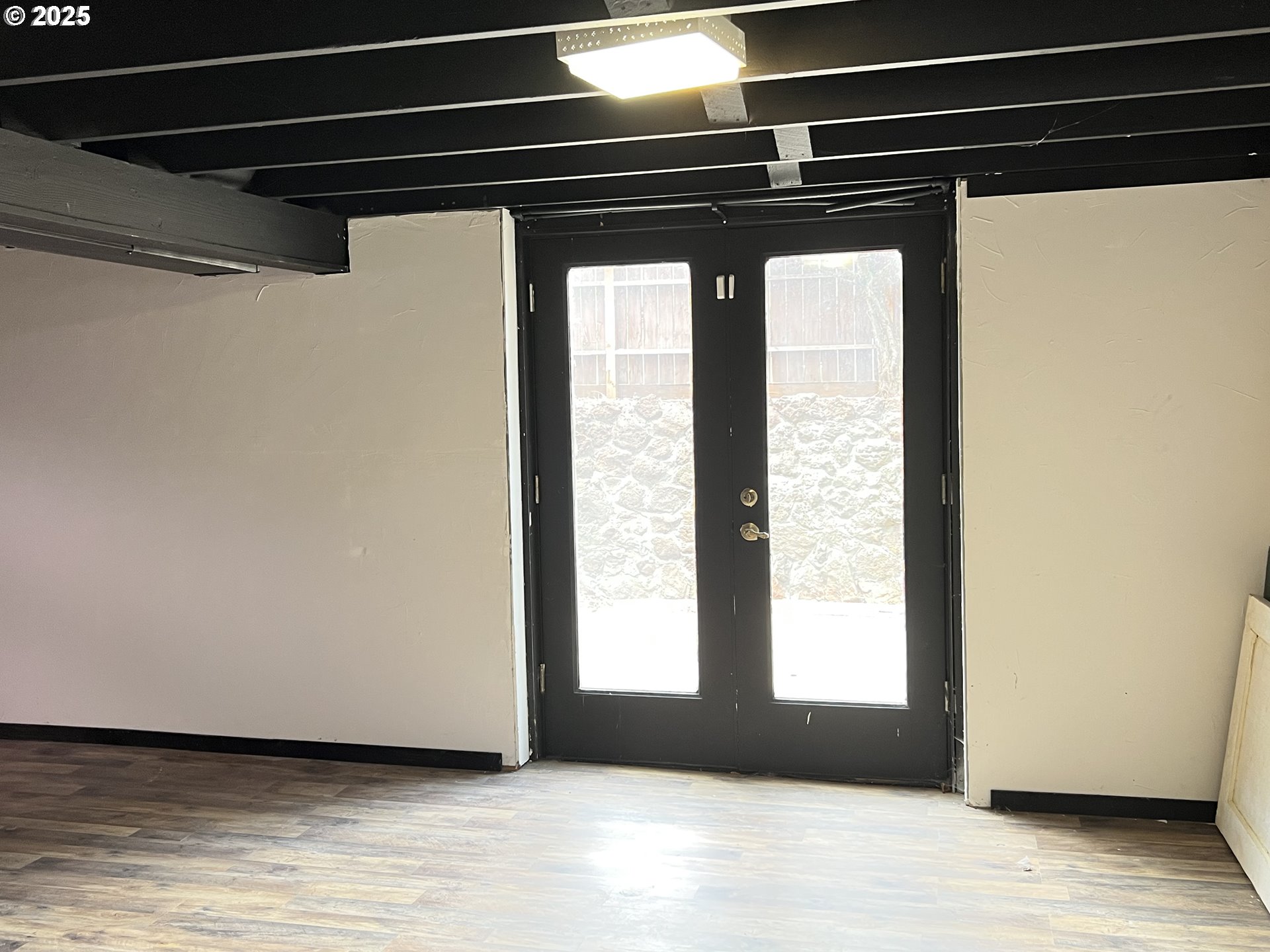175 Baltimore Street Heppner, OR 97836 - Photo 20 of 28 a view of a room with wooden floor and windows