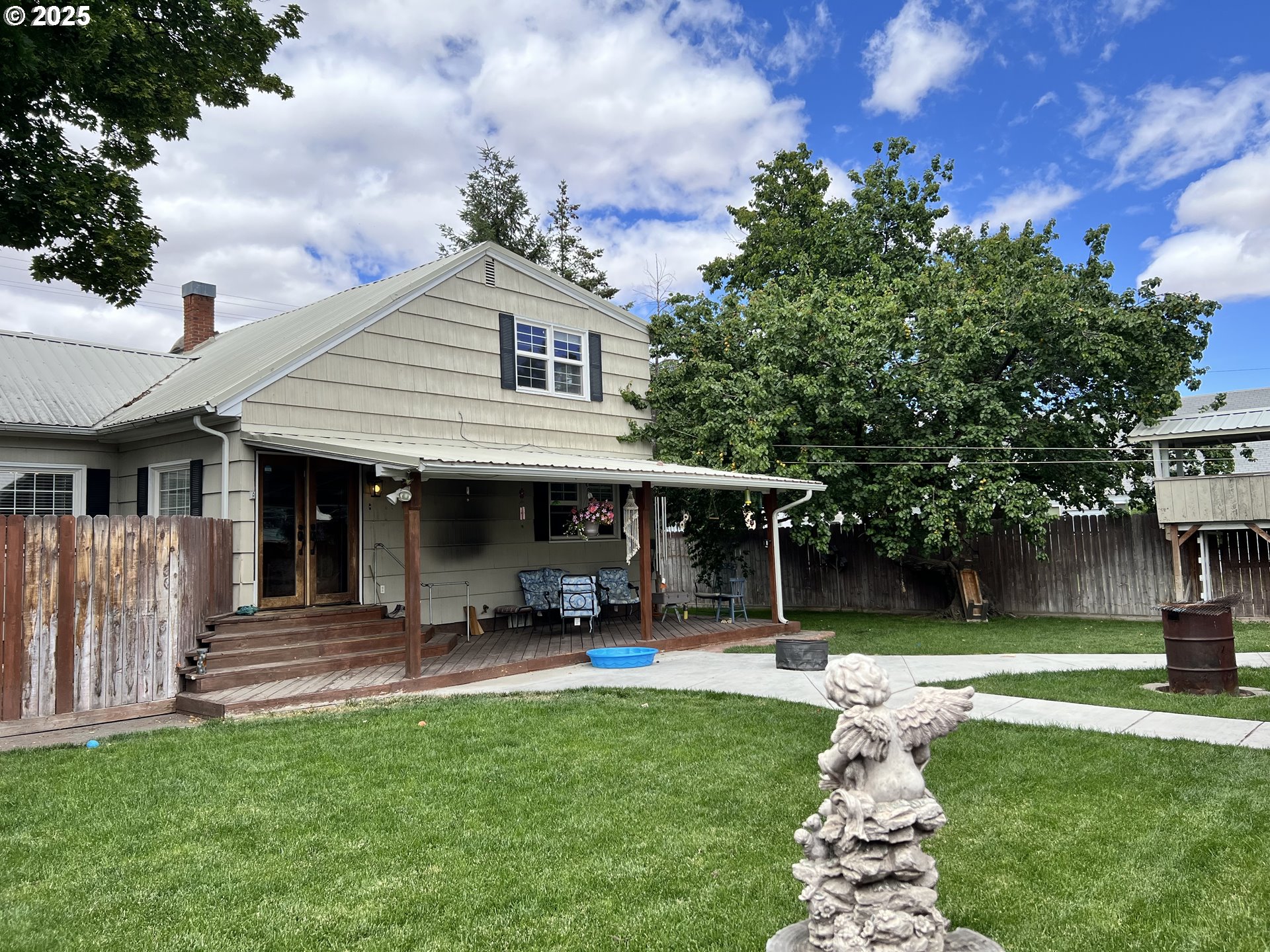 175 Baltimore Street Heppner, OR 97836 - Photo 24 of 28 a front view of a house with swimming pool and garden