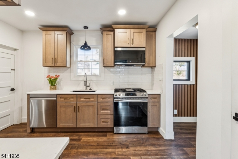 64 Hillcrest Road Watchung, NJ 07069 - Photo 14 of 42 a kitchen with stainless steel appliances granite countertop a stove a sink and a microwave