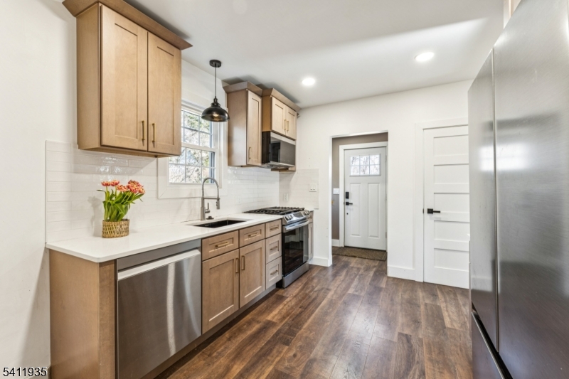 64 Hillcrest Road Watchung, NJ 07069 - Photo 16 of 42 a kitchen with stainless steel appliances granite countertop a sink stove and refrigerator