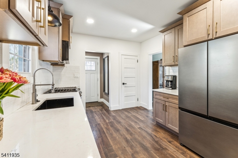 64 Hillcrest Road Watchung, NJ 07069 - Photo 17 of 42 a kitchen with stainless steel appliances a refrigerator and a stove