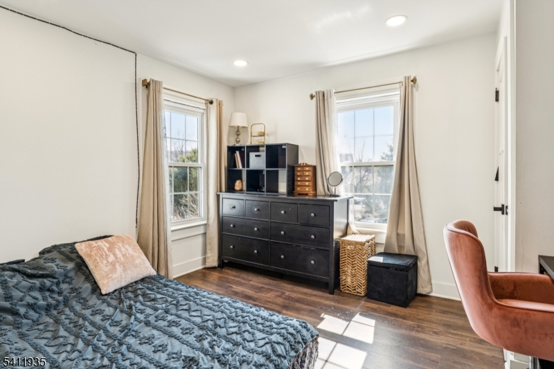 64 Hillcrest Road Watchung, NJ 07069 - Photo 23 of 42 a bedroom with a bed and wooden floor