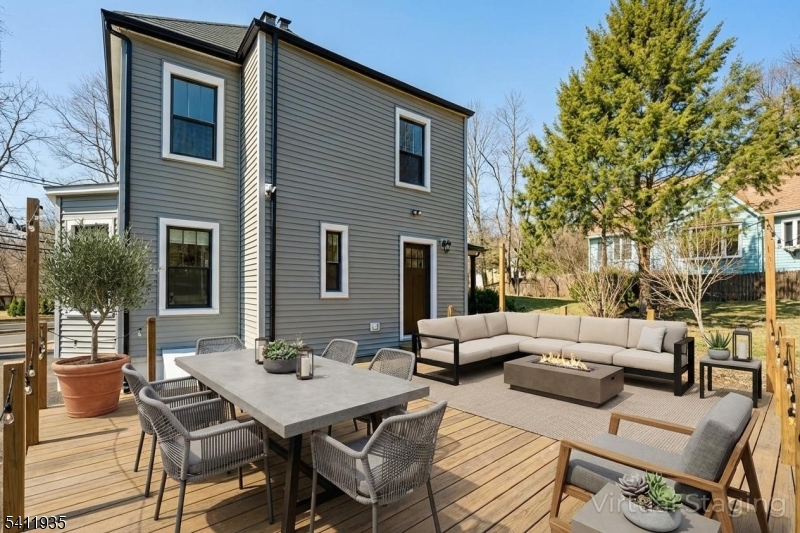64 Hillcrest Road Watchung, NJ 07069 - Photo 32 of 42 a view of a patio with couches table and chairs and potted plants