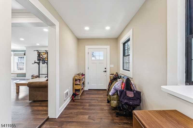 64 Hillcrest Road Watchung, NJ 07069 - Photo 4 of 42 a view of a hallway with wooden floor and furniture