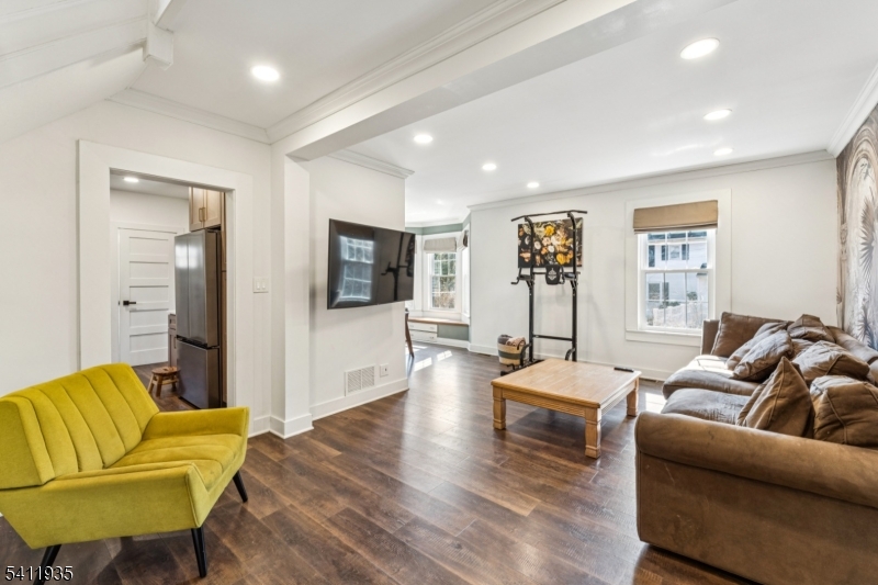 64 Hillcrest Road Watchung, NJ 07069 - Photo 7 of 42 a living room with furniture and a flat screen tv