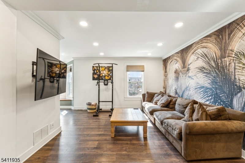 64 Hillcrest Road Watchung, NJ 07069 - Photo 9 of 42 a living room with furniture and a flat screen tv