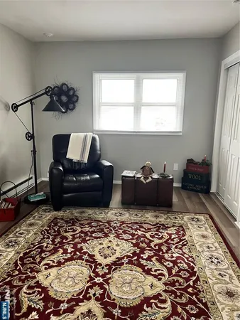 a living room with a couch and a window