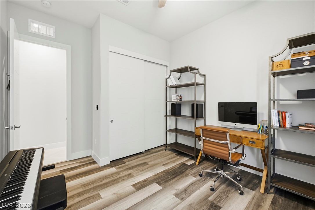45 Garibaldi Way Henderson, NV 89011 - Photo 32 of 74 Functional home office or studio space with durable wood-look flooring and a generous closet for storage.