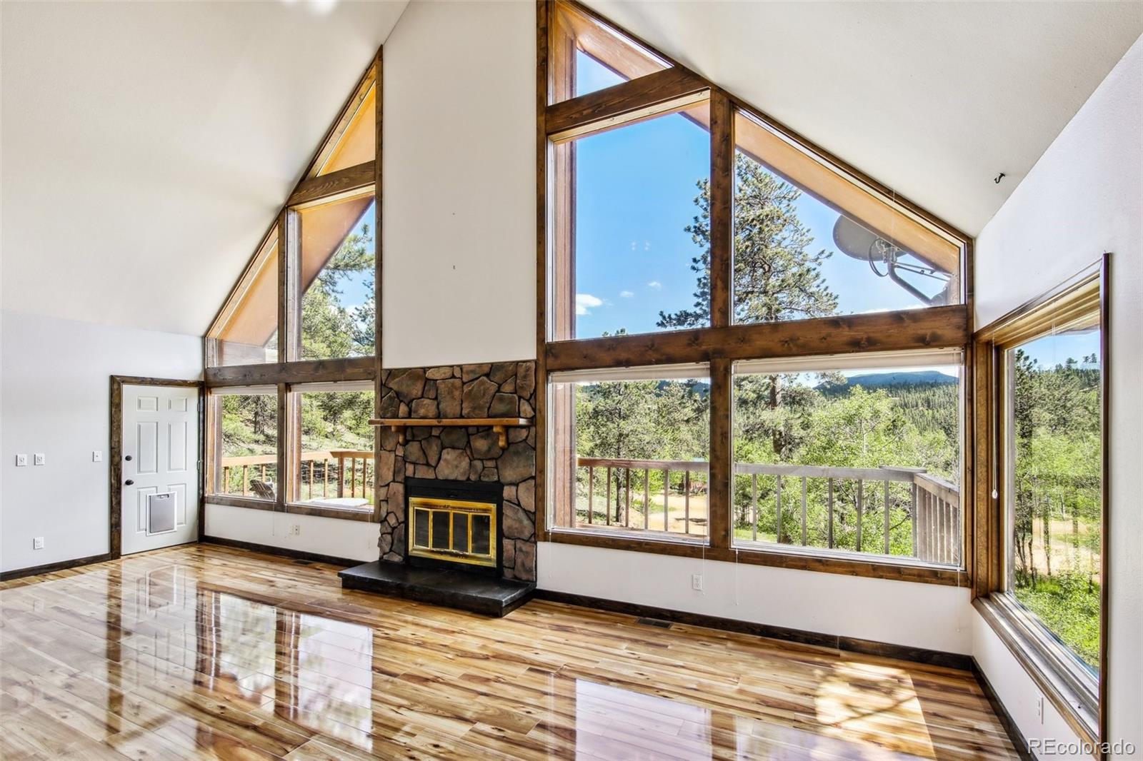 141 Tall Timber Lane Bailey, CO 80421 - Photo 11 of 40 a view of livingroom with furniture and workspace