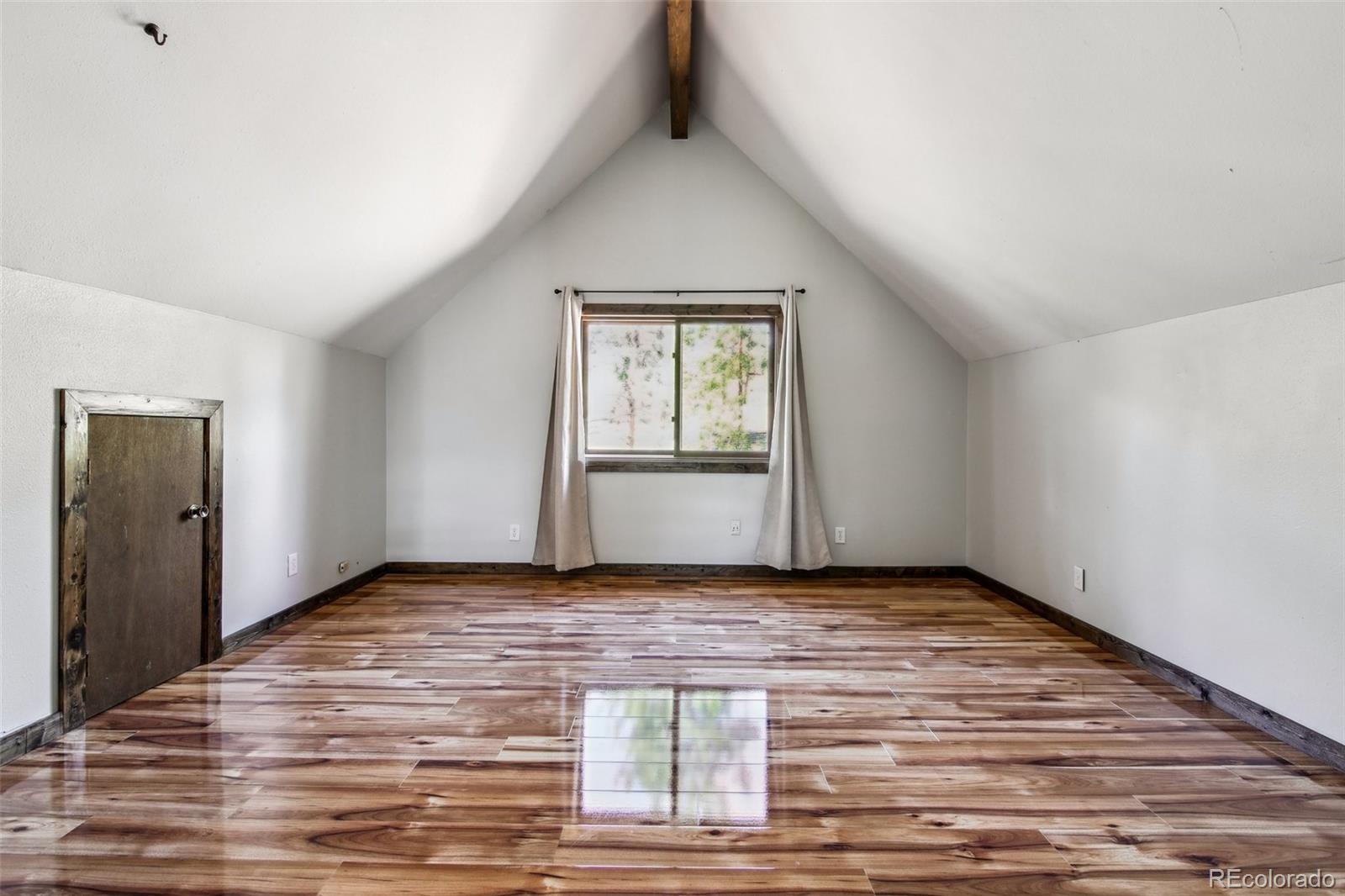 141 Tall Timber Lane Bailey, CO 80421 - Photo 14 of 40 a view of an empty room and window