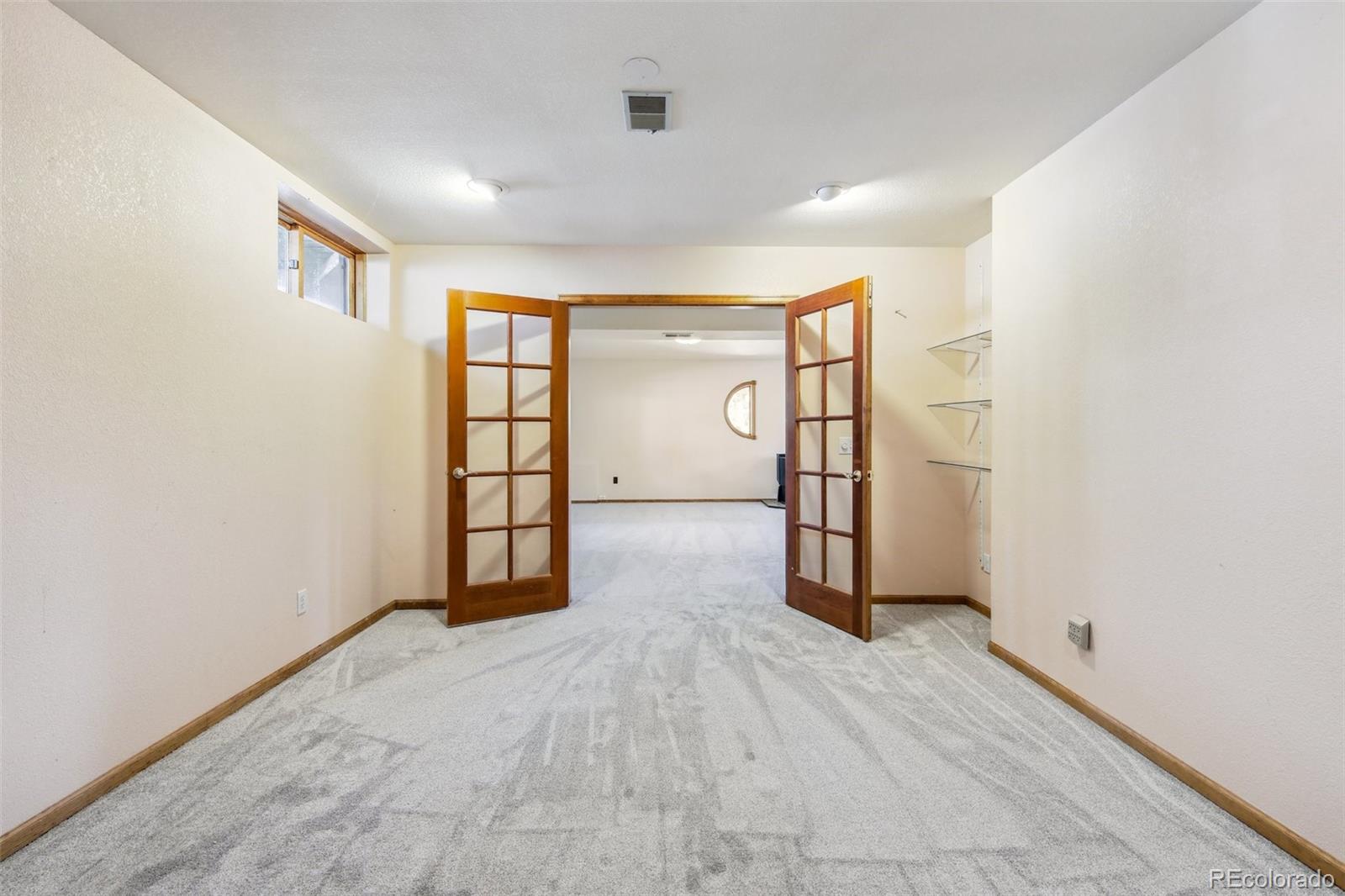 141 Tall Timber Lane Bailey, CO 80421 - Photo 33 of 40 an empty room with windows and closet