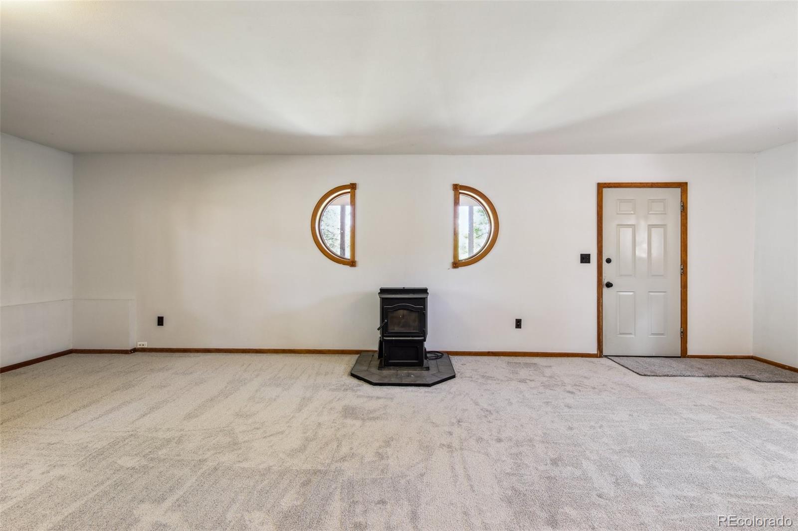 141 Tall Timber Lane Bailey, CO 80421 - Photo 39 of 40 a view of a livingroom with wooden floor
