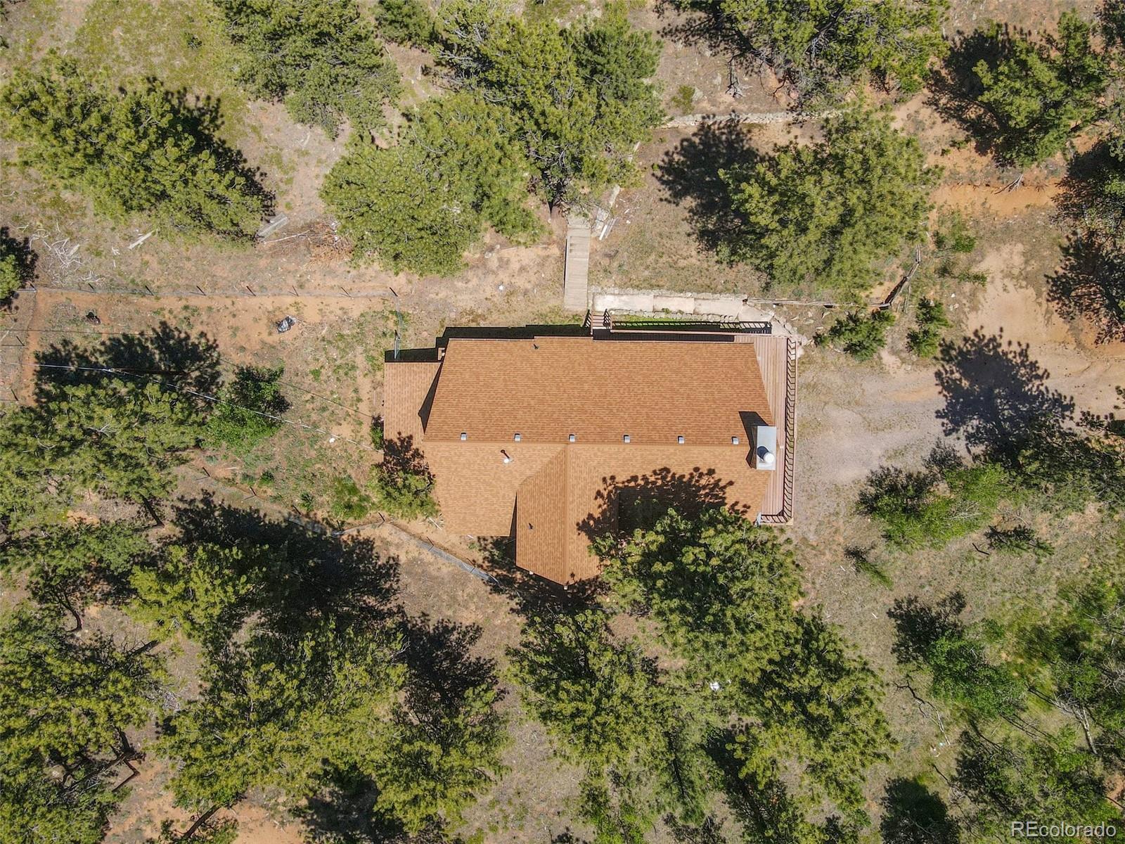 141 Tall Timber Lane Bailey, CO 80421 - Photo 4 of 40 an aerial view of a house with yard