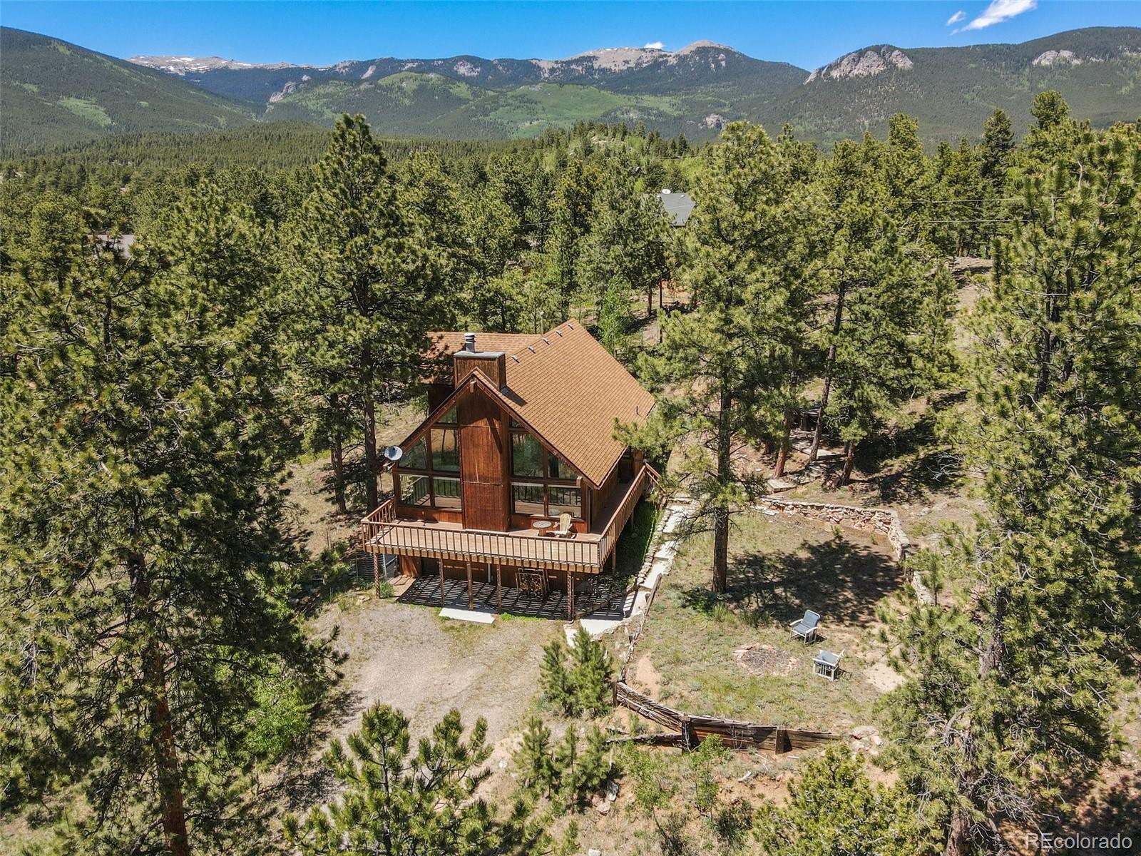 141 Tall Timber Lane Bailey, CO 80421 - Photo 6 of 40 a view of a small house with a mountain