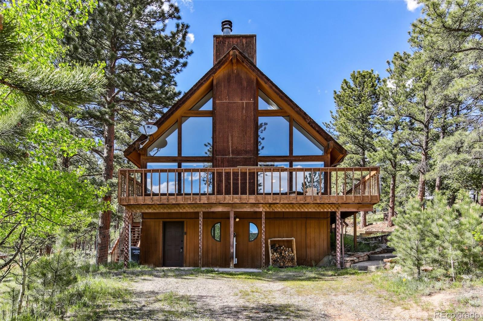 141 Tall Timber Lane Bailey, CO 80421 - Photo 8 of 40 a front view of a house with a yard