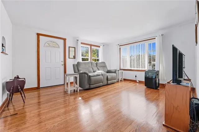 a living room with furniture window and a flat screen tv