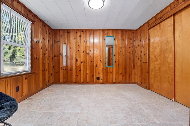 a view of room with a window and a shower curtain