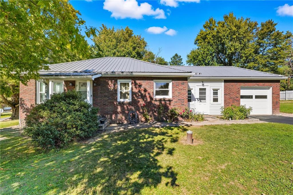 105 Williamson Road Greenville, PA 16125 - Photo 2 of 27 a front view of a house with a garden