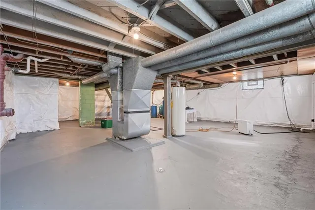 a view of empty room with wooden walls