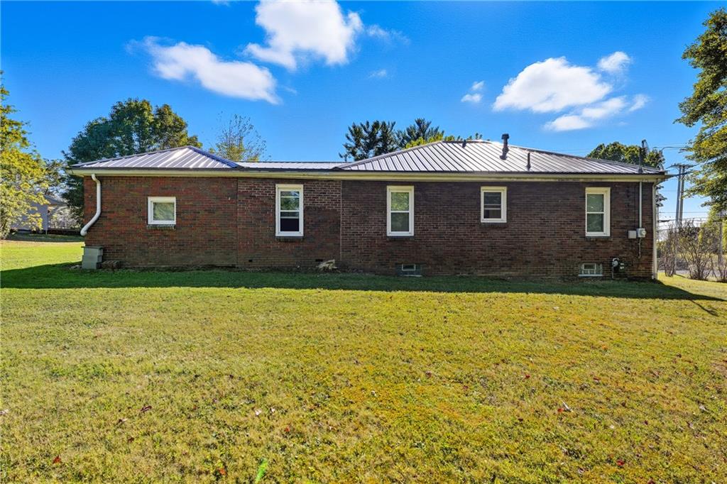105 Williamson Road Greenville, PA 16125 - Photo 5 of 27 a front view of house with yard and trees in the background