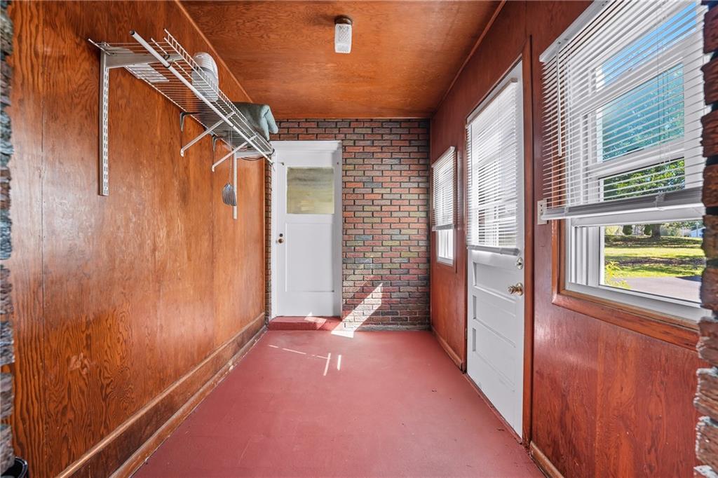 105 Williamson Road Greenville, PA 16125 - Photo 8 of 27 a view of a porch with wooden floor and windows