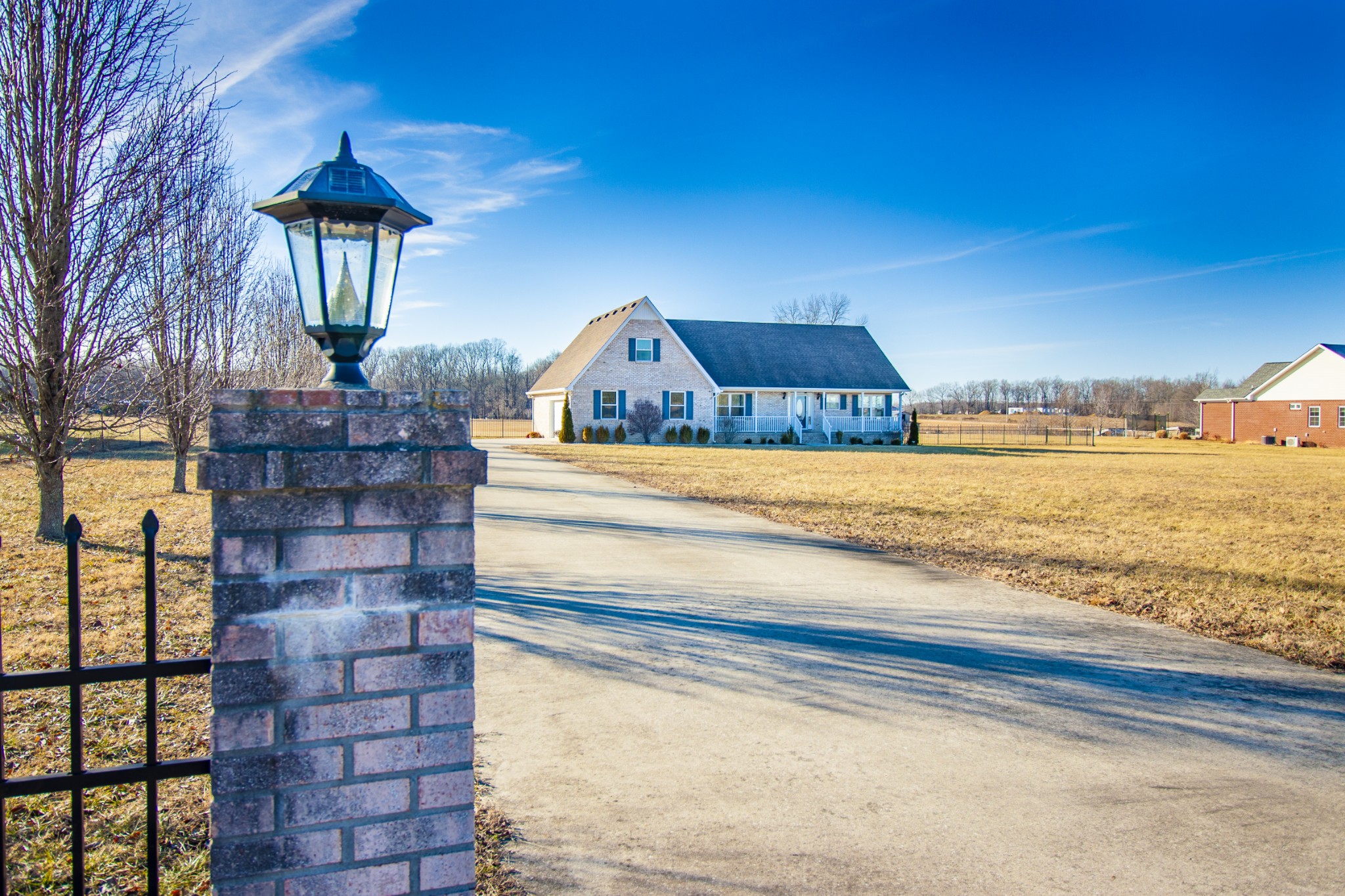 6875 Maple Springs Road Manchester, TN 37355 - Photo 16 of 36 a front view of a house with a yard
