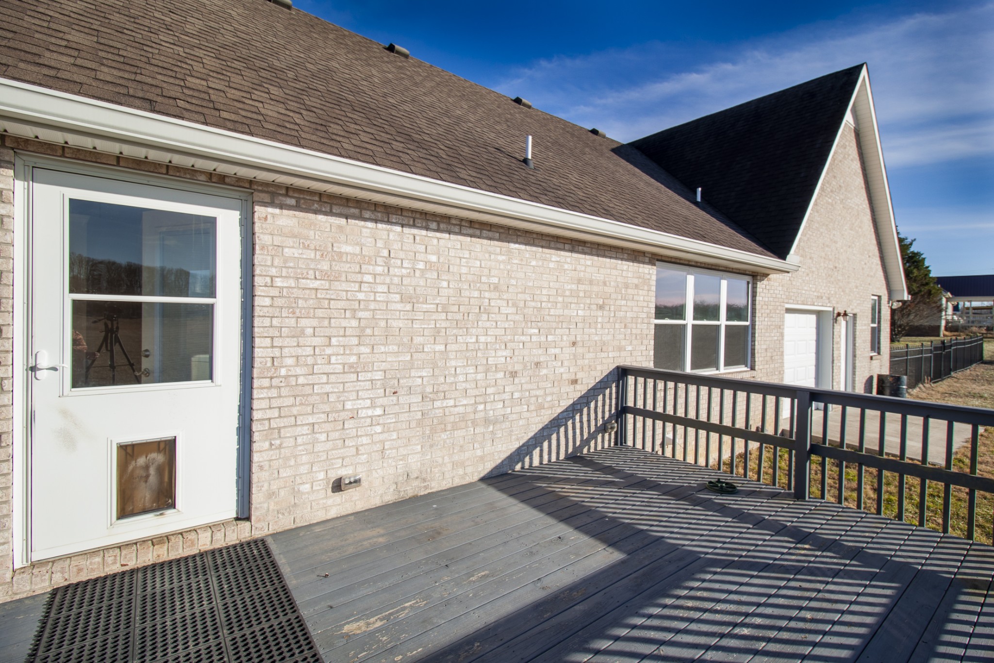 6875 Maple Springs Road Manchester, TN 37355 - Photo 17 of 36 a view of a balcony with wooden floor and fence