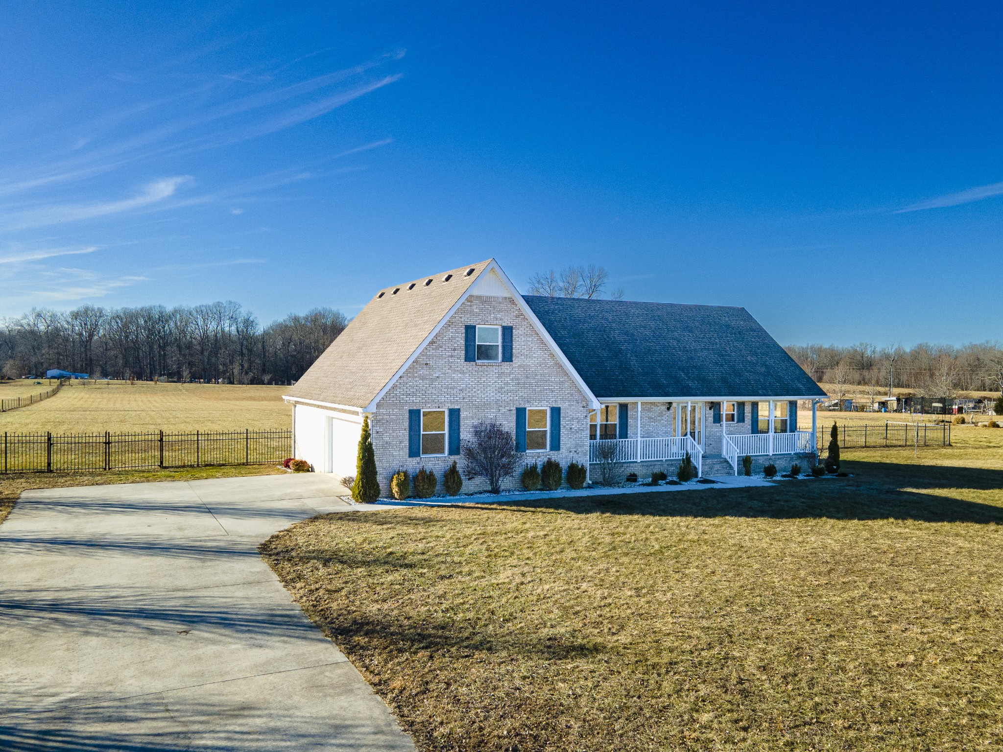 6875 Maple Springs Road Manchester, TN 37355 - Photo 2 of 36 a front view of a house with a yard